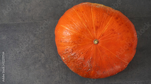 To make a pumpkin dessert, orange pumpkin, a whole pumpkin, shot from above,
