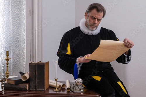 Recreation of a writer of the Spanish Golden Age (1492 to 1659), writing at his desk