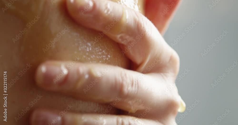 Macro of Hand Touching Body with Goosebumps and Honey Massaging into Skin a Concept of Body Care Shot on Red Camera Macro of Hand Touching Body with Goosebumps and Honey Massaging into Skin a Concept of Body Care Shot on Red Camera