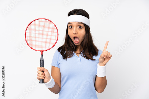 Young badminton player woman over isolated white background thinking an idea pointing the finger up © luismolinero