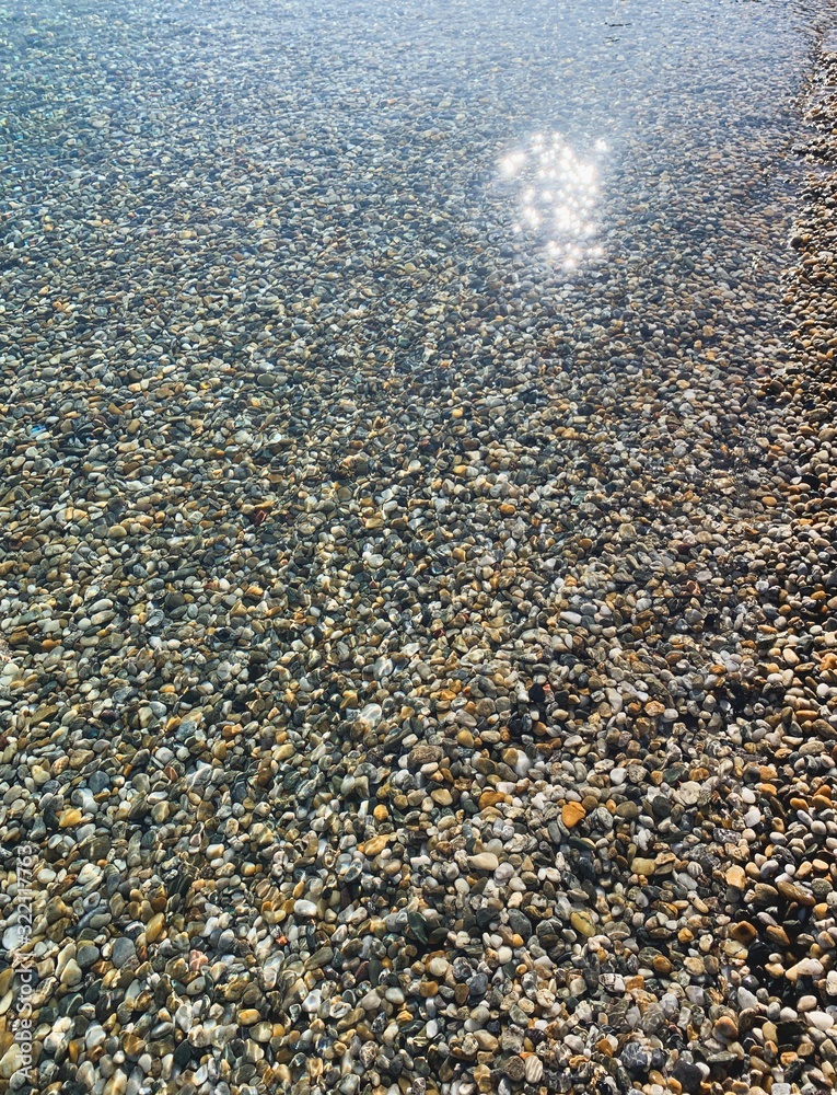 Transparent sea water with pebbles Transparent sea water with pebbles