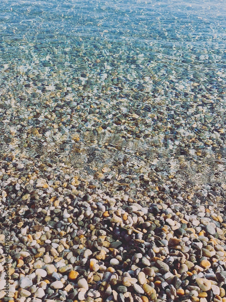 Transparent sea water with pebbles Transparent sea water with pebbles
