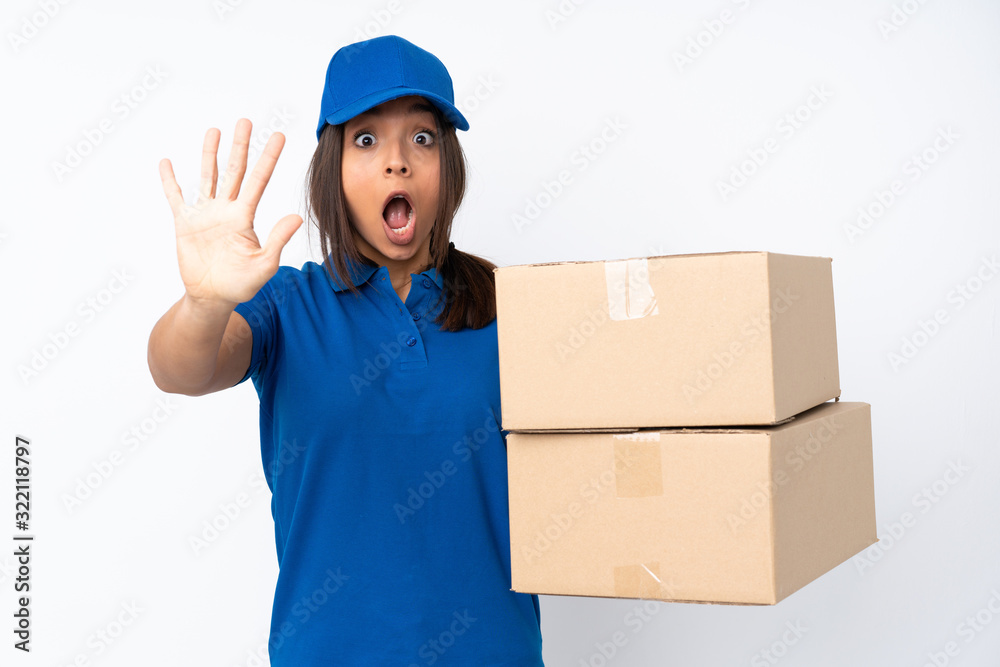 Young delivery brunette girl over isolated white background counting five with fingers Young delivery brunette girl over isolated white background counting five with fingers