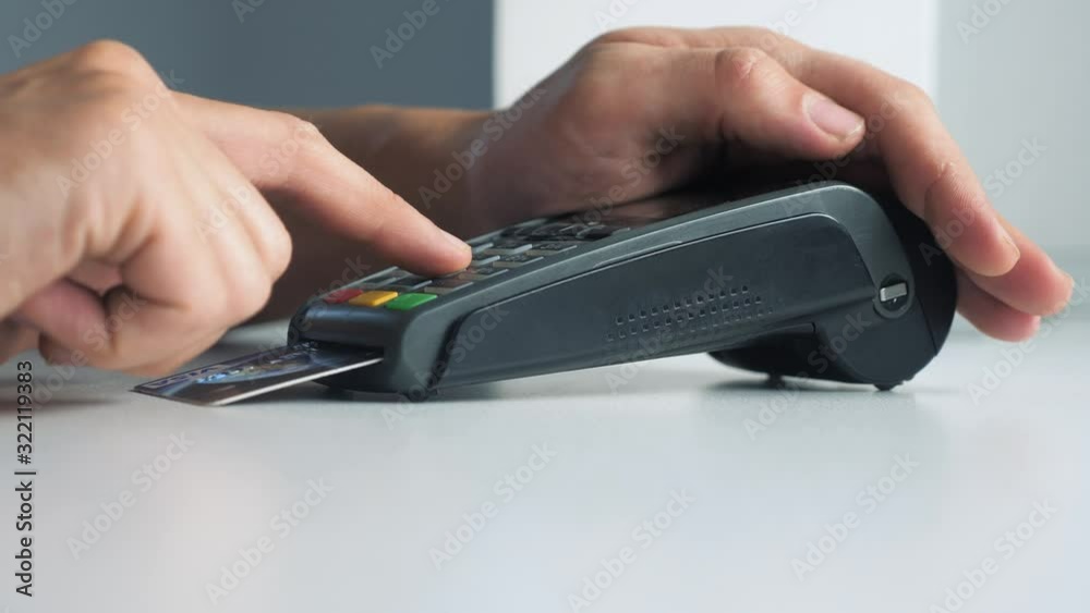 Payment by credit card, purchase and sale of goods and services. lifestyle Credit card in the store. girl pays the card reader online shopping concept Payment by credit card, purchase and sale of goods and services. lifestyle Credit card in the store. girl pays the card reader online shopping concept