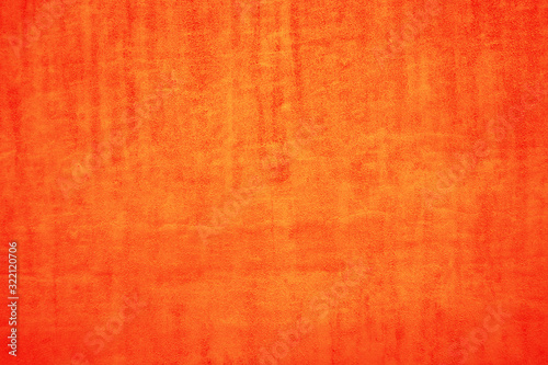 The texture of the orange surface. Orange paper background. Festive orange paper