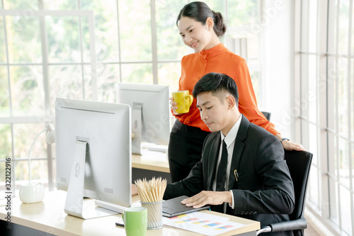 Business people working together on computer