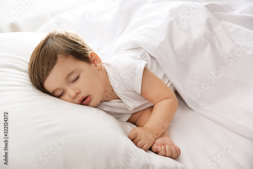 Cute little baby peacefully sleeping at home. Bedtime