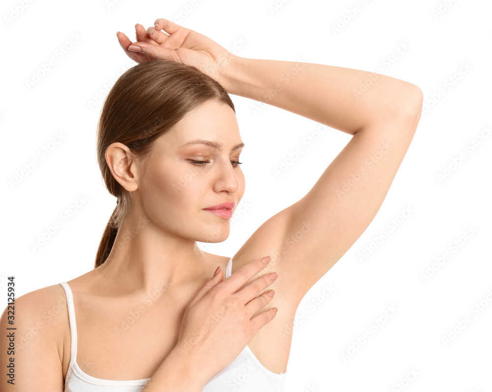 Young beautiful woman showing armpit with smooth clean skin on white background Young beautiful woman showing armpit with smooth clean skin on white background