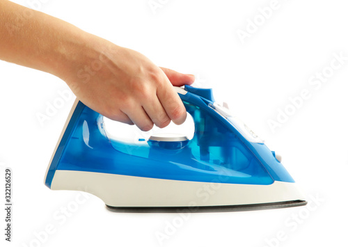 Young woman's hand holding iron on white background