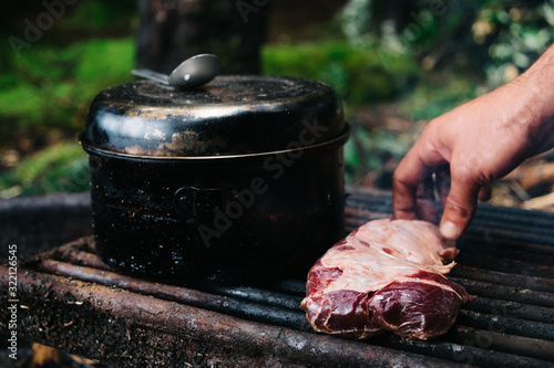 Cooking black bear meat on the campfire
