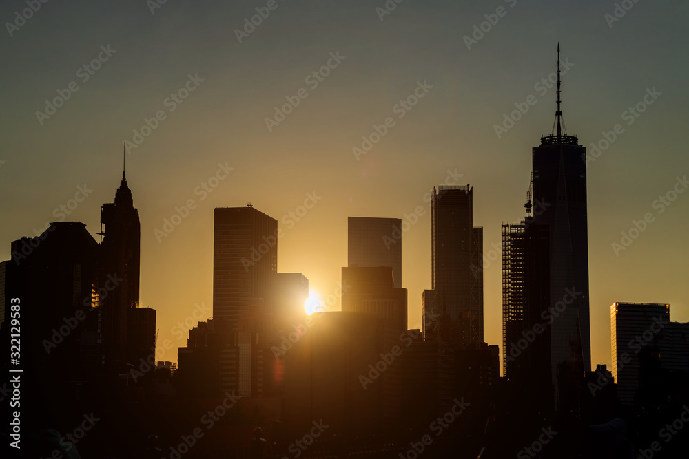 Manhattan sunset with illuminated at dusk in New York City, USA Manhattan sunset with illuminated at dusk in New York City, USA