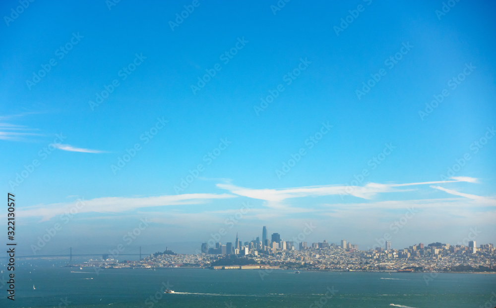 Modern coastal city skyline with blue sky
