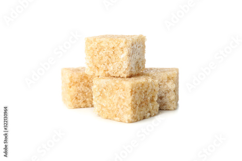 Brown sugar cubes isolated on white background, close up