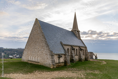 Etretat, Normandy, France - The church at the top of the northern cliff ('Amont' cliff) photo