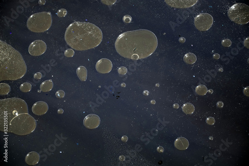 abstract air bubbles under ice