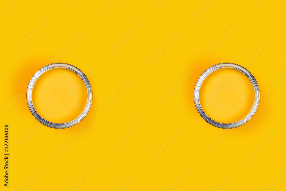 Repair concept. Yellow background with two color paint cans. Flat lay, top view, copy space. Repair concept. Yellow background with two color paint cans. Flat lay, top view, copy space.