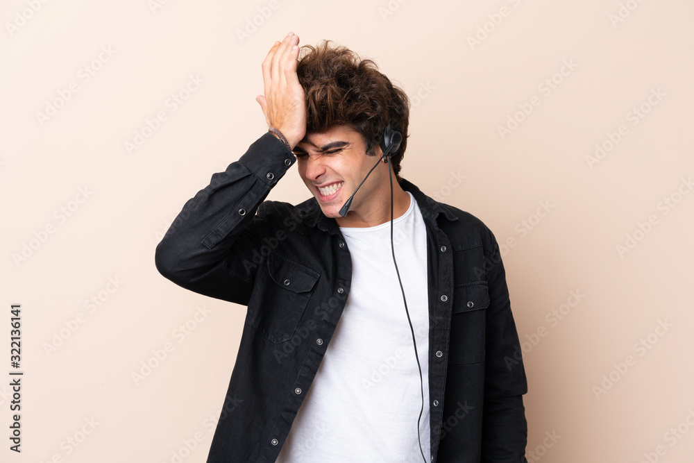 Telemarketer man working with a headset over isolated background having doubts with confuse face expression Telemarketer man working with a headset over isolated background having doubts with confuse face expression
