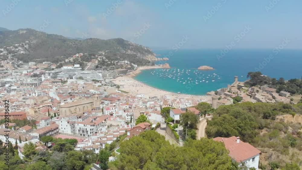 Beautiful rocky coast with beach and boats Beautiful rocky coast with beach and boats