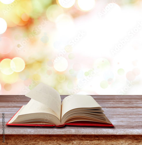 Book on table in front of blurred background