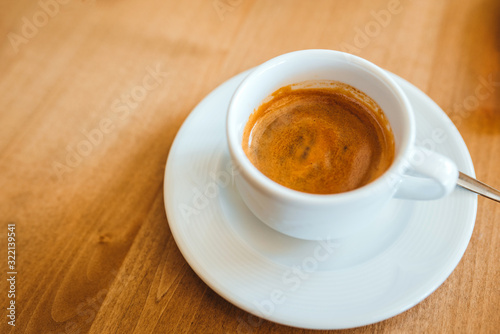 Coffee on a wooden cafe table photo