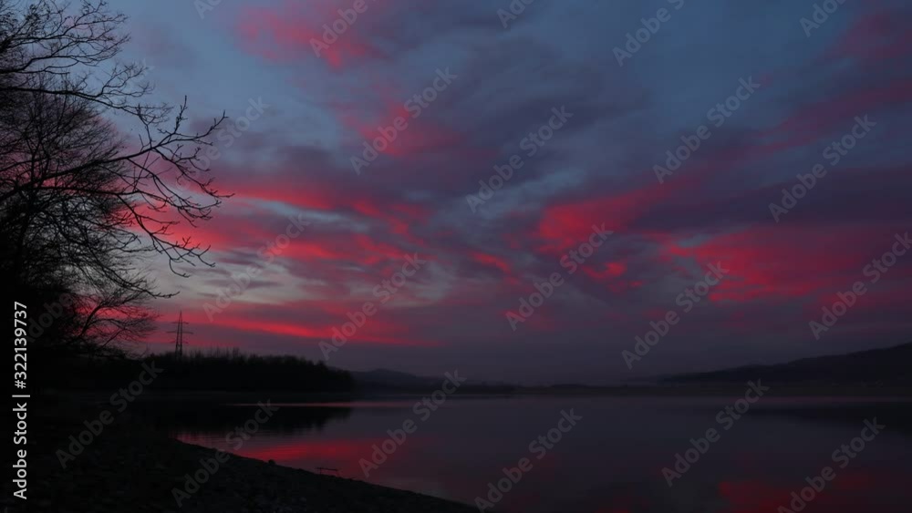 Timelapse lake sunrise sunset clouds reflections