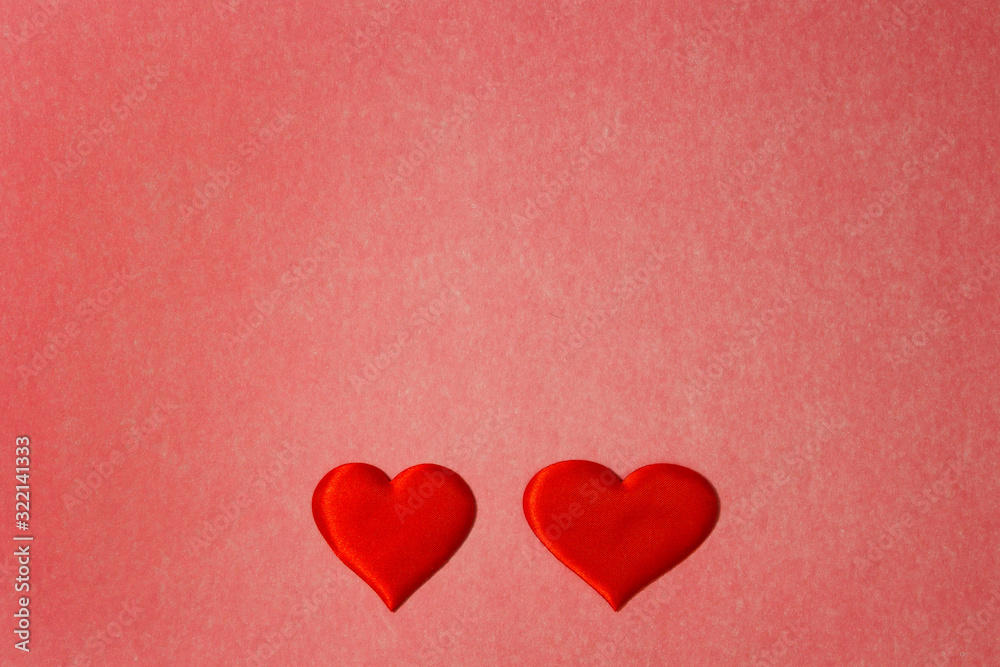 Two red hearts on a red color cardboard background. Copy space, Valentines Day concept Two red hearts on a red color cardboard background. Copy space, Valentines Day concept