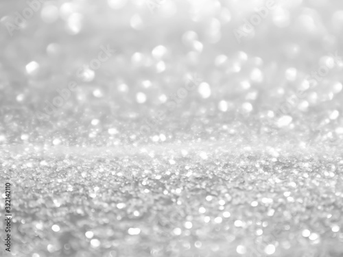 Background christmas snowing. Glitter lights snow winter.Bokeh White on Blurred Background.