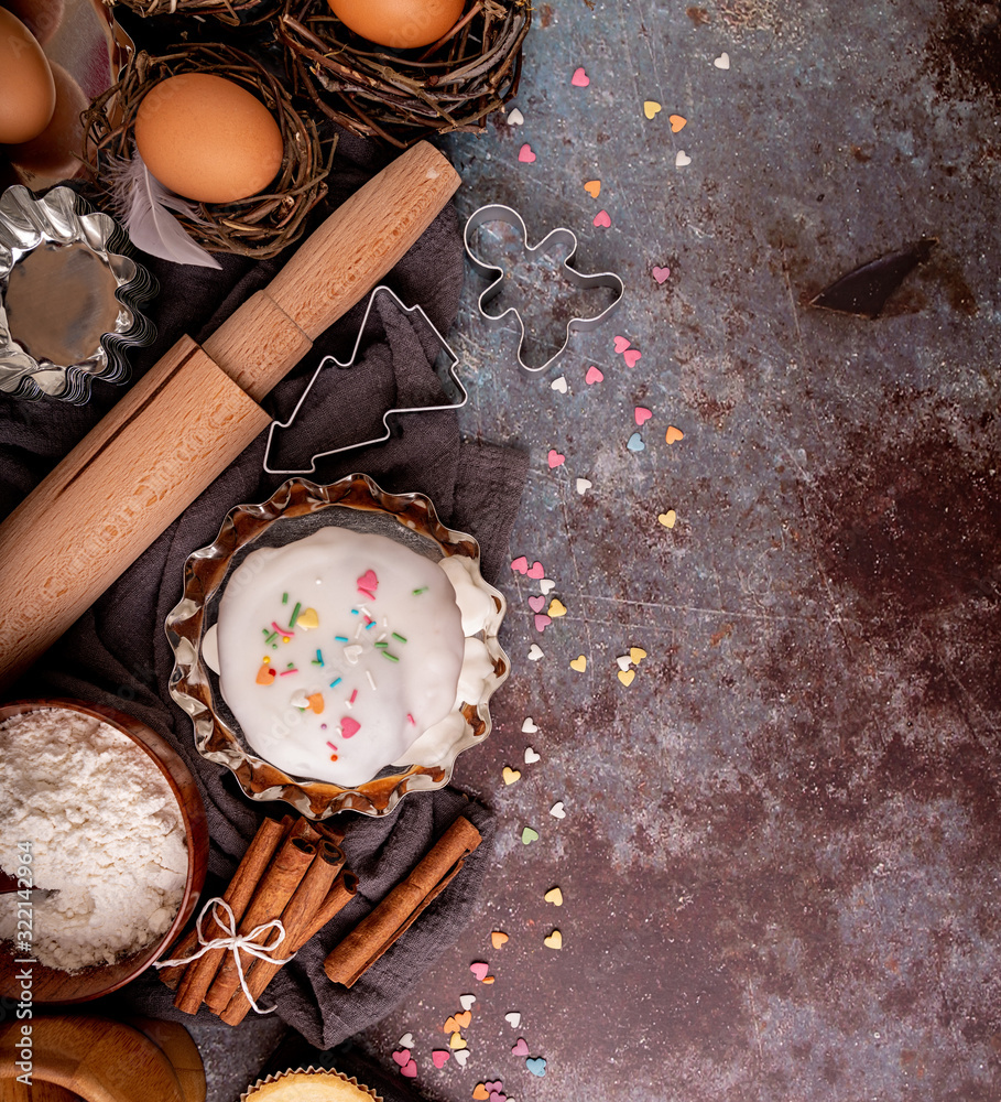 baking ingredients for a cake top view on dark rough background baking ingredients for a cake top view on dark rough background