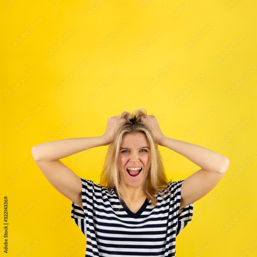 Woman in surprise joy grabbed her hair. Blonde girl surprised and shocked looks on you and screaming with delight. Expressive facial expressions emotions of fun and pleasure Woman in surprise joy grabbed her hair. Blonde girl surprised and shocked looks on you and screaming with delight. Expressive facial expressions emotions of fun and pleasure