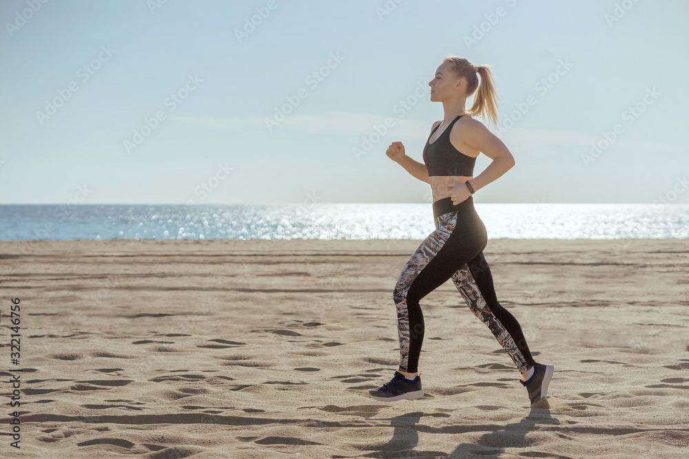 woman running outdoors with sea on background; female jogger full length view training seaside; sport and fitness concept. woman running outdoors with sea on background; female jogger full length view training seaside; sport and fitness concept.