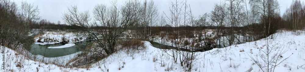 Panoramic view with winter river and snow forest. Beautiful winter landscape Panoramic view with winter river and snow forest. Beautiful winter landscape