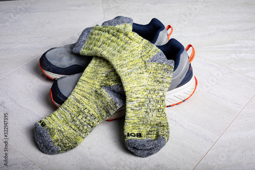 Schilderij op canvas Yellow Bombas calf socks shown with athletic shoes