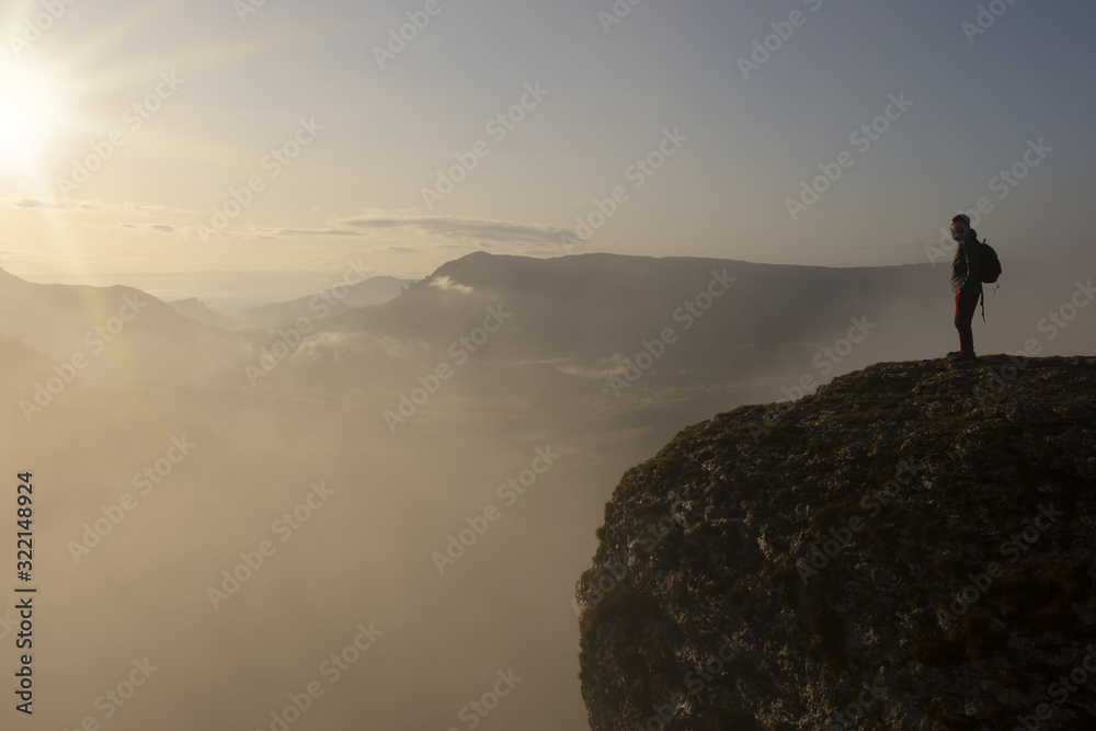 man on the edge of the cliff with the sun at dawn, Balcon de Pilatos, Sierra de Urbasa, Navarra