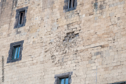 Facade of the Angevin male in Naples hit by a cannonball
