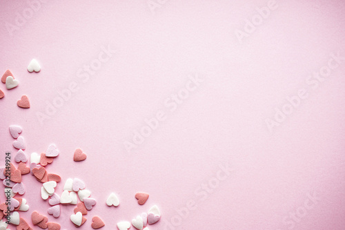 Sweet hearts on a pink background, with space for text, flat lay. Valentine's Day. Love concept. Mother's day background.