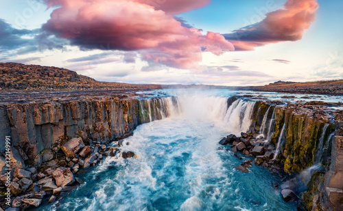 Fototapeta Naklejka Na Ścianę i Meble -  View from flying drone of Selfoss Waterfall. Incredible summer sunrise on Jokulsa a Fjollum river, Jokulsargljufur National Park. Colorful morning scene of Iceland, Europe.