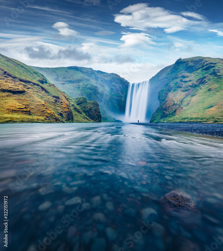 Gorgeous evening view of Skogafoss Waterfall. Beautiful summer landscape of Skoga river. Amazing outdoor scene of Iceland  Europe. Beauty of nature concept background.