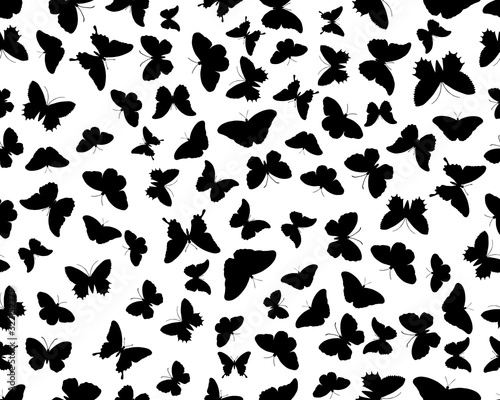 Seamless pattern with black silhouettes of butterflies on white background