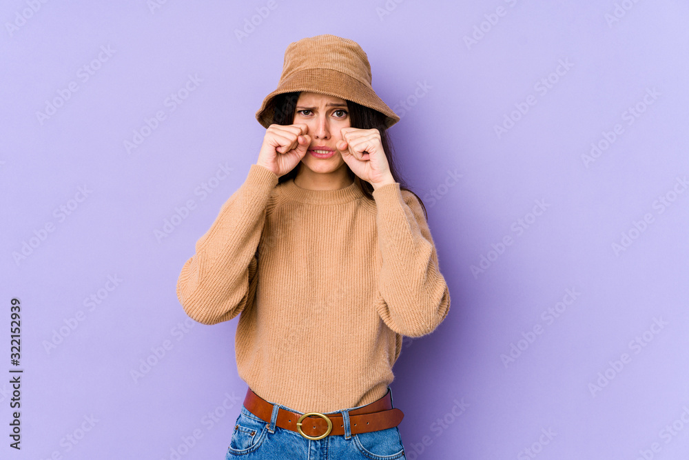Young caucasian woman isolated on purple background whining and crying disconsolately. Young caucasian woman isolated on purple background whining and crying disconsolately.
