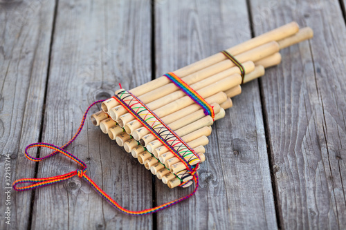 Pan flute (panpipes or syrinx) a musical instrument lying on square-edged flooring