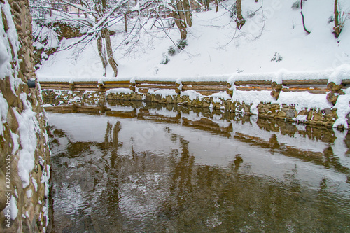 Alpine river in the village of Lumshory in the Zakarpattia region. Carpathians, Ukraine. February 2013 photo