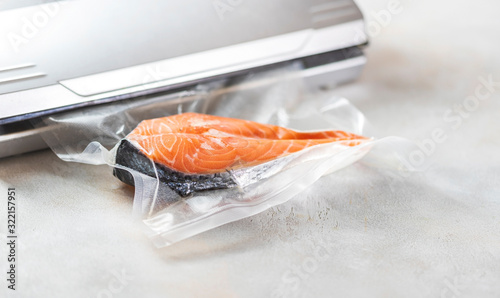 Salmon fillets in a vacuum package. Sous-vide, new technology cuisine. photo