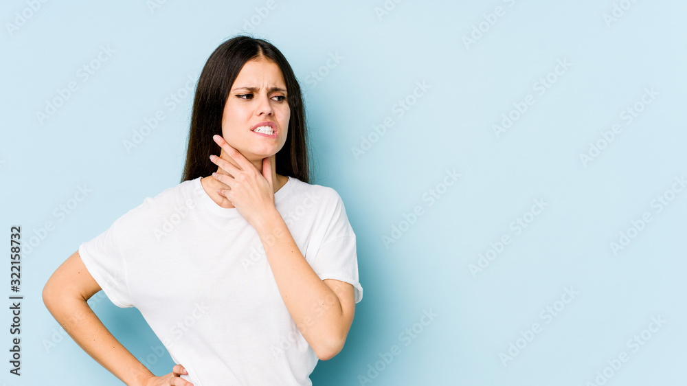 Young caucasian woman isolated on blue background touching back of head, thinking and making a choice. Young caucasian woman isolated on blue background touching back of head, thinking and making a choice.