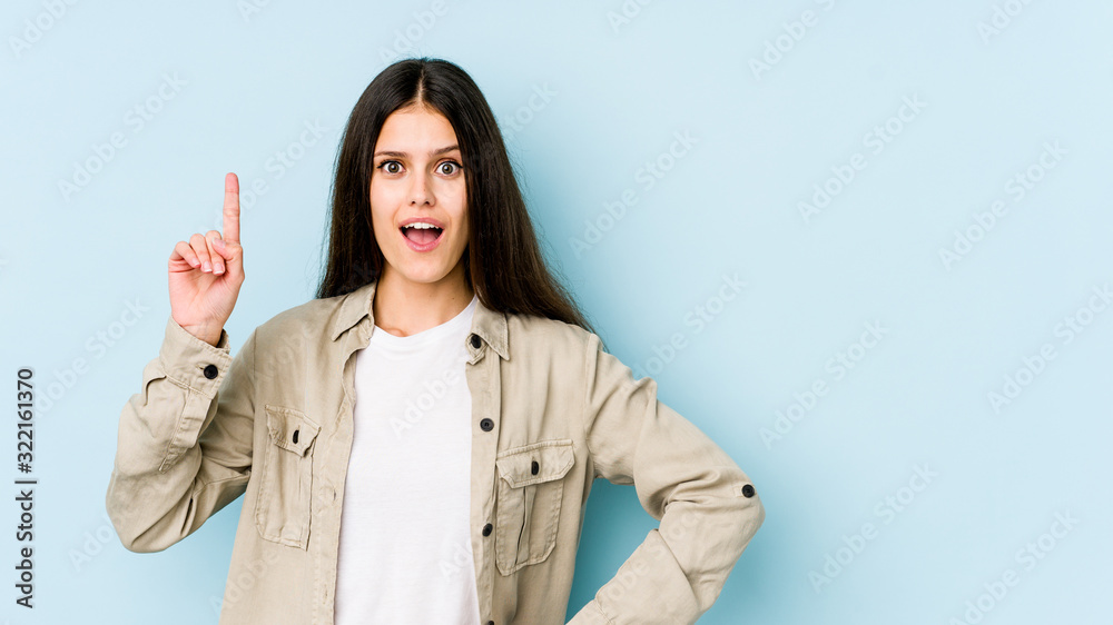 Young caucasian woman isolated on blue background having an idea, inspiration concept. Young caucasian woman isolated on blue background having an idea, inspiration concept.
