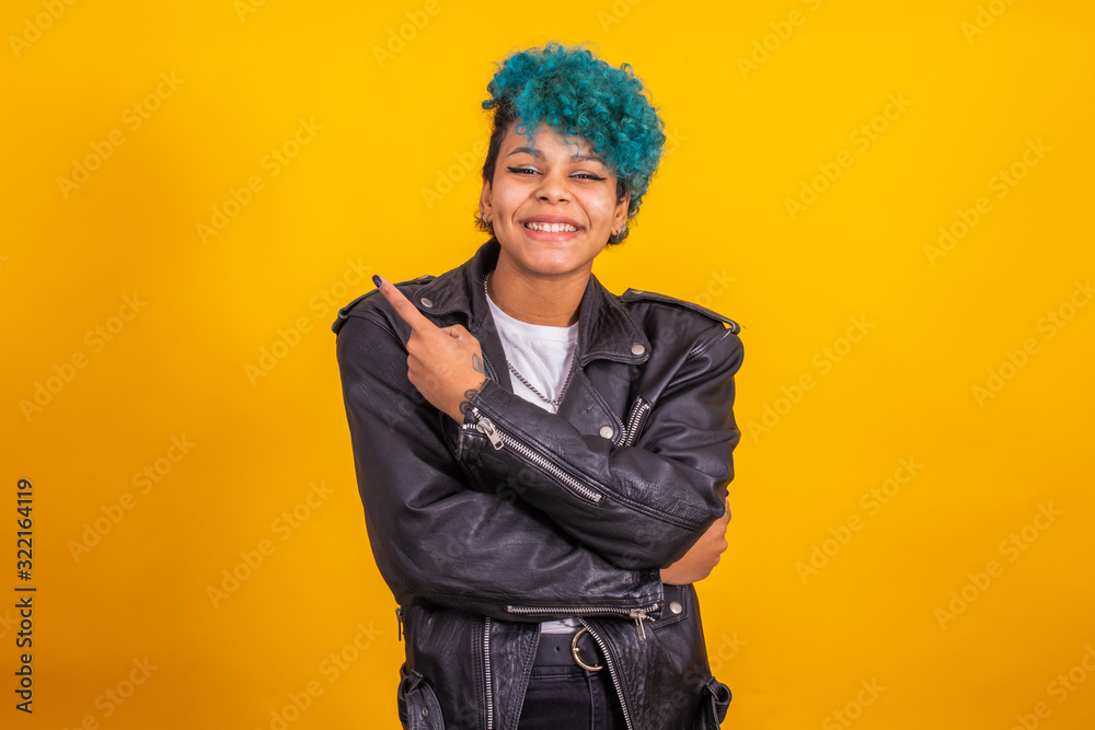 urban afro american young girl in urban fashion isolated on color background urban afro american young girl in urban fashion isolated on color background