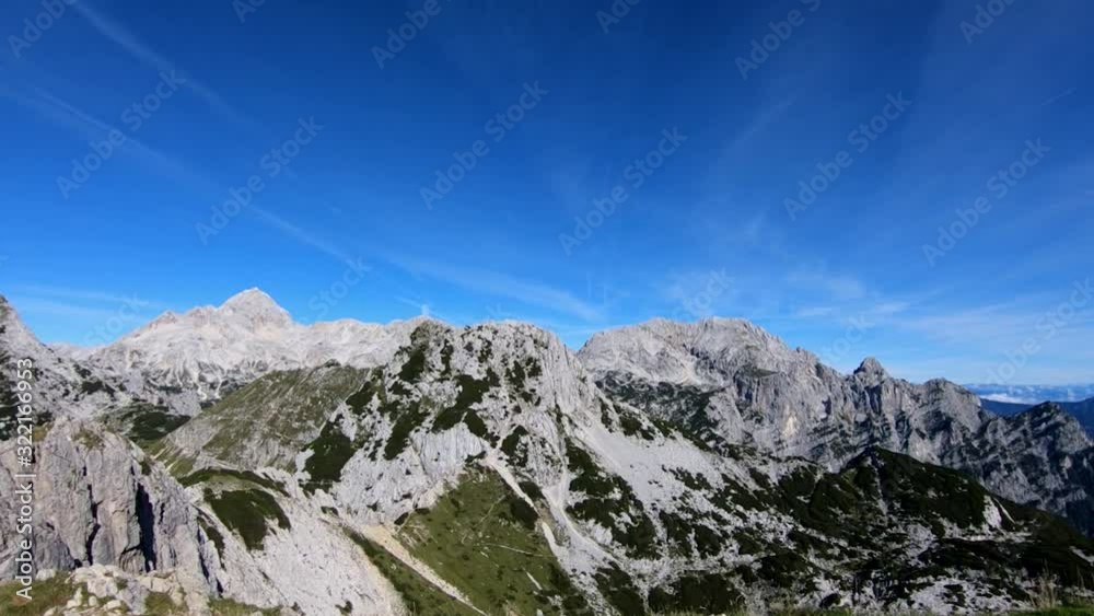 Wide shot right pan Julian Alps mountains range in Slovenia Wide shot right pan Julian Alps mountains range in Slovenia