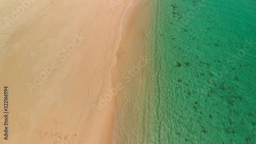 Aerial reveal of a tropical beach with turquoise water, Miyako-jima, Okinawa, Japan photo