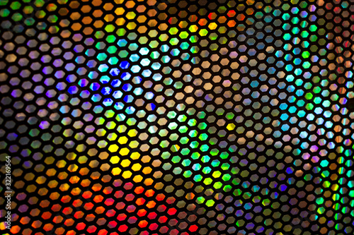 textile background, multi-colored shiny texture on the fabric.