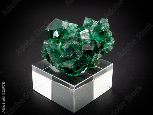 natural green fluorite mineral on black background photo