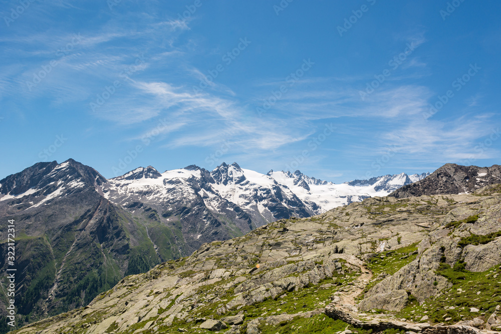 Hiking through spectacular mountain landscape of Gran Paradiso Natural Park. Hiking through spectacular mountain landscape of Gran Paradiso Natural Park.